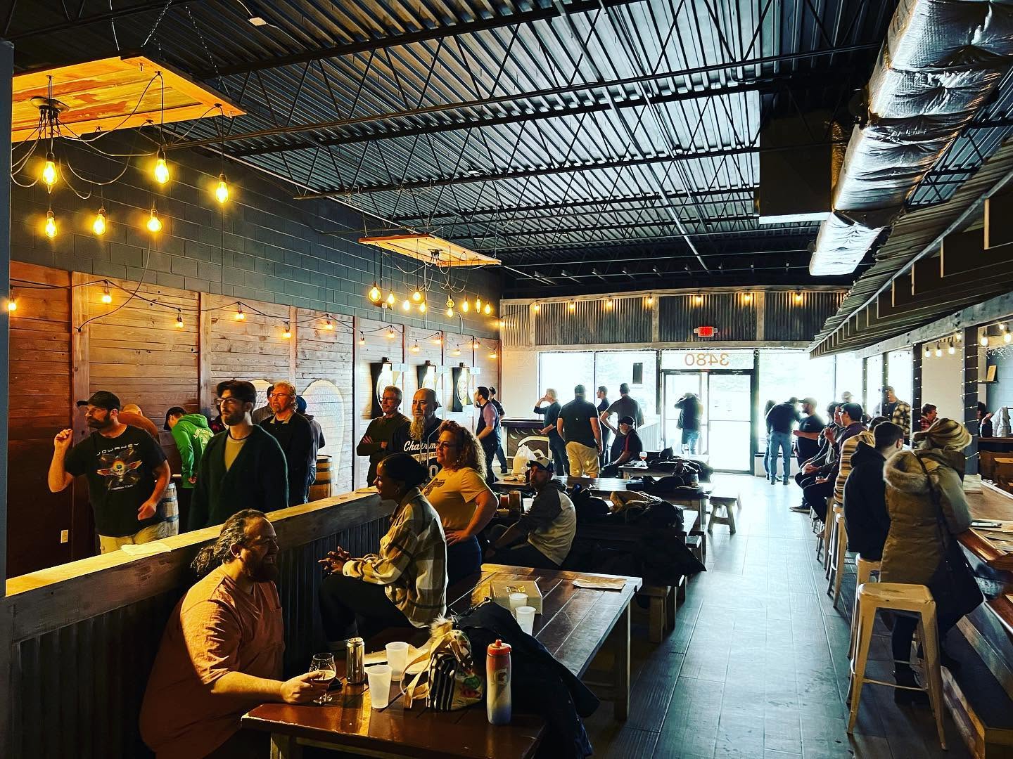 Patrons enjoying the Wax Wings Brewing Co. taproom